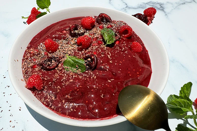 cherry, acai, pomegranate & raspberry smoothie bowl with all the toppings.