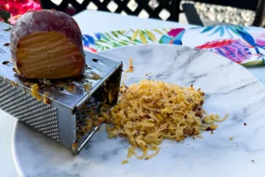 grated frozen peaches on a plate.