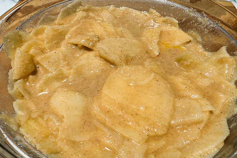 apples soaking in batter.