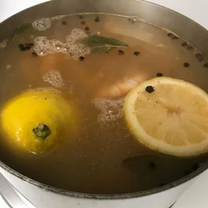 shrimp boiling in seasoned water.