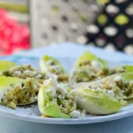 Belgian endive salad cups on a plate.