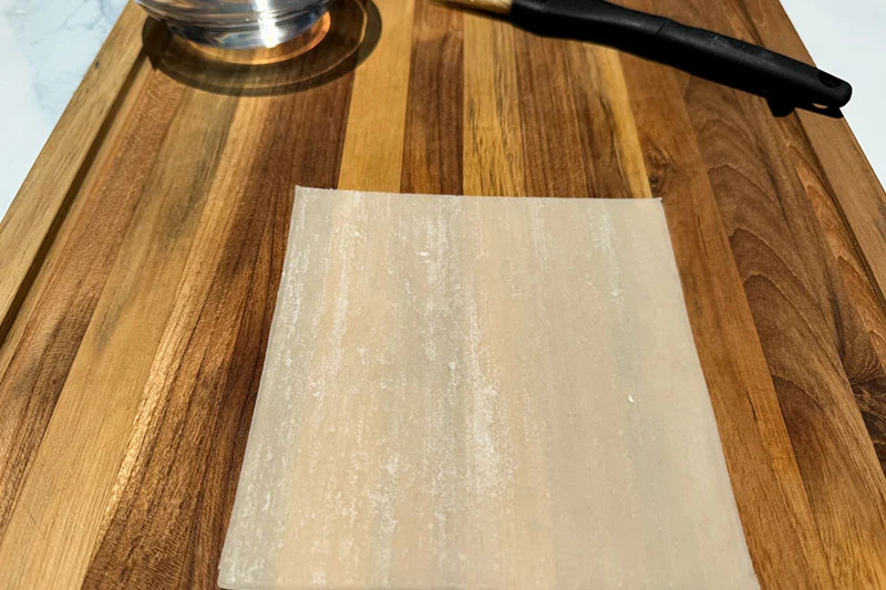 spring roll wrapper on cutting board.