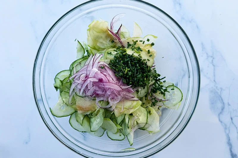 all the fruit and veggies in a bowl.