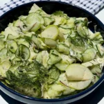 cucumber and apple salad in a bowl.