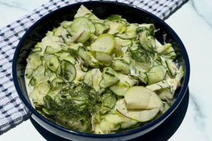 cucumber and apple salad in a bowl.