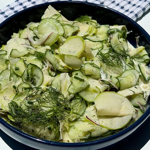 cucumber and apple salad in a bowl.