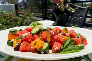 a platter of watermelon, peach, feta salad.