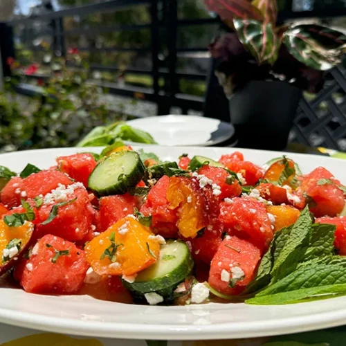 a platter of watermelon, peach, feta salad.