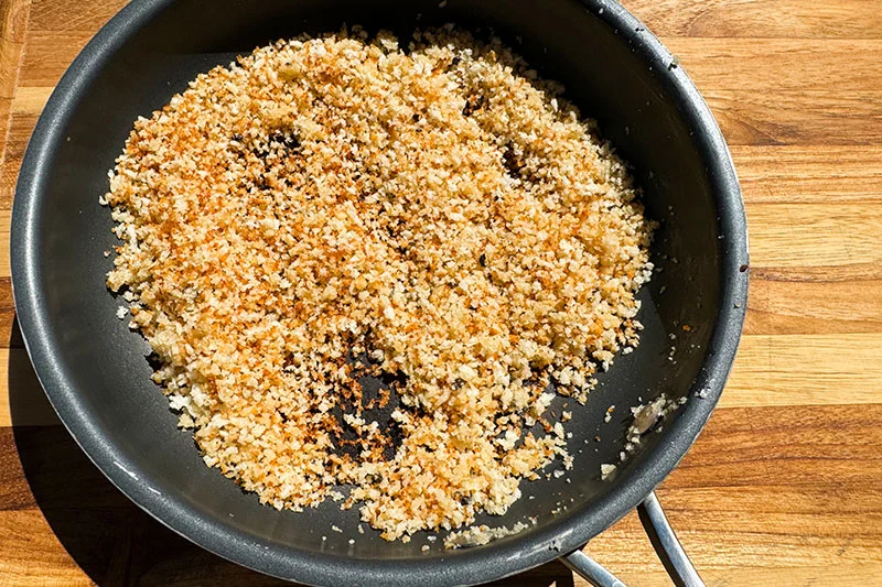 panko toasting in skillet.