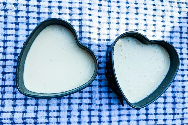 cottage cheese cake batter in heart shaped cake pans.