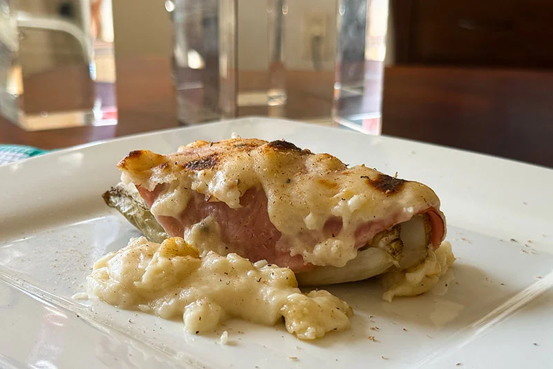 belgian endive and ham au jambon on a plate.