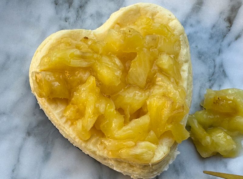 Cottage cheese cake topped with pineapple.