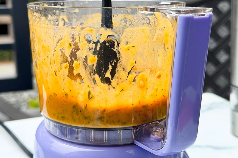 food processor with pumpkin maple vinaigrette in it.