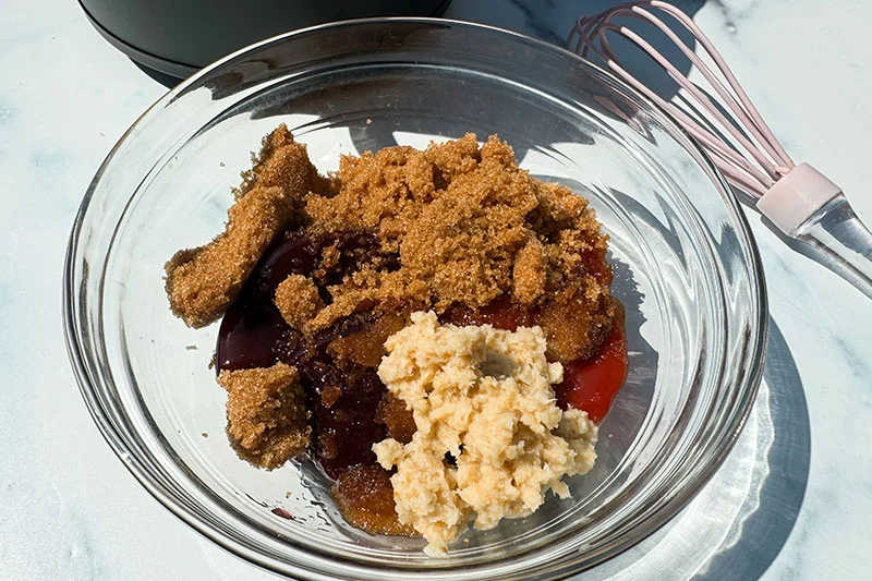 ingredients for sweet and spicy sauce in a bowl.