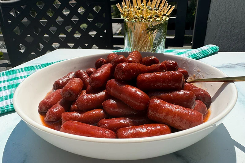 sweet and spidy lil beef smokies in a bowl.