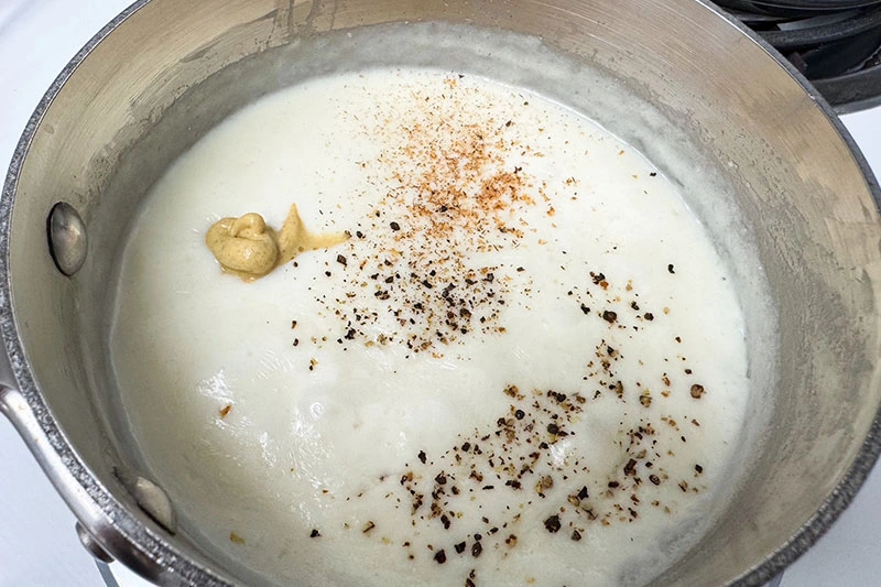 béchamel sauce with mustard and nutmeg.