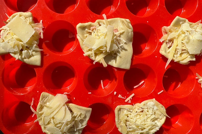 filled pastry cups ready for oven.