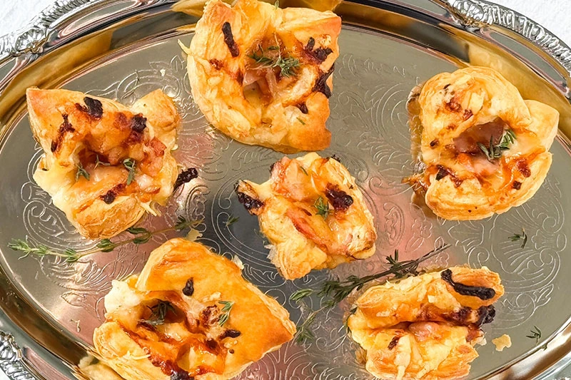 croque monsieur appetizers on a serving tray.