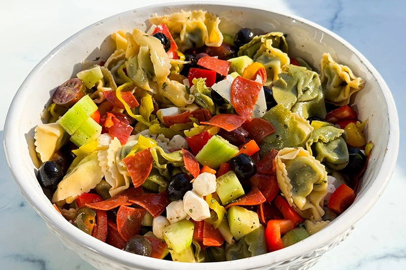 a bowl of Italian tortellini pasta salad.