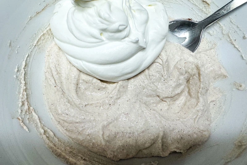 whipped cream on mixed cheese mixture.