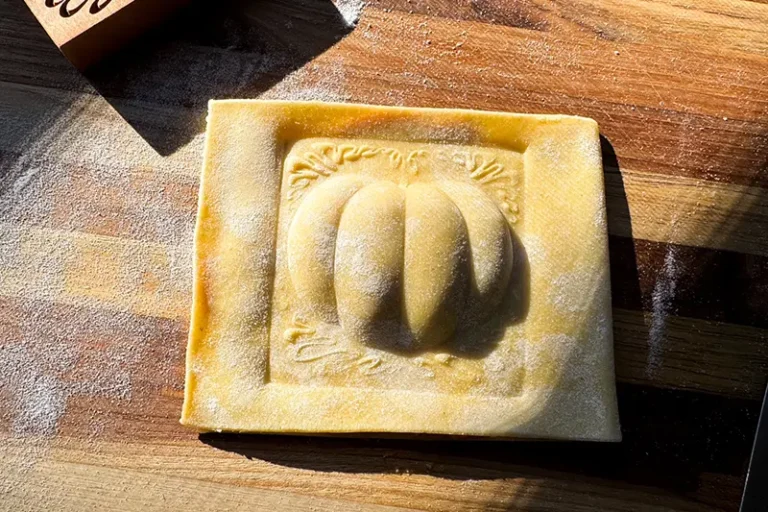 pumpkin shaped ravioli ready to be cut.