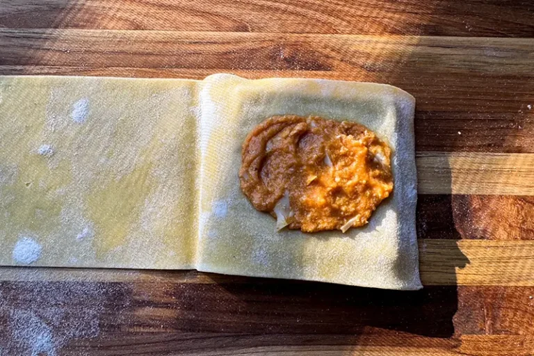 pumpkin filling in ravioli mold.