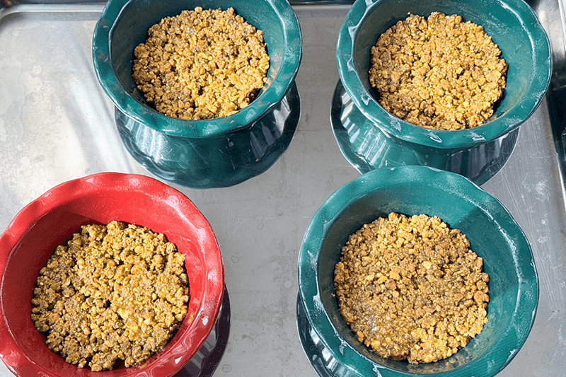 pistachio crust in pie plates.