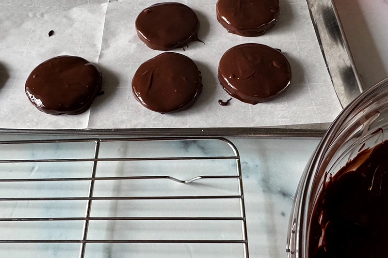 thin mints glazed on a baking sheet.