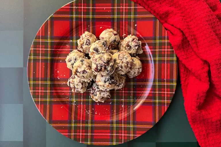 white chocolate, pecan and berry bites on a platter.