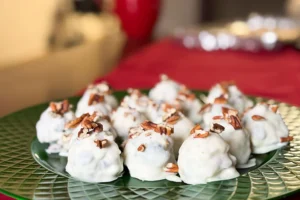 white chocolate pecan and berry bites dipped in white chocolate.