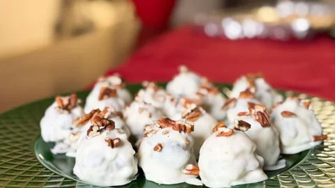 white chocolate pecan and berry bites dipped in white chocolate.