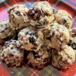 white chocolate, pecan and berry bites on a platter.