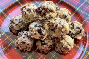 white chocolate, pecan and berry bites on a platter.