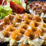 high protein waffle made with chicken on a plate.