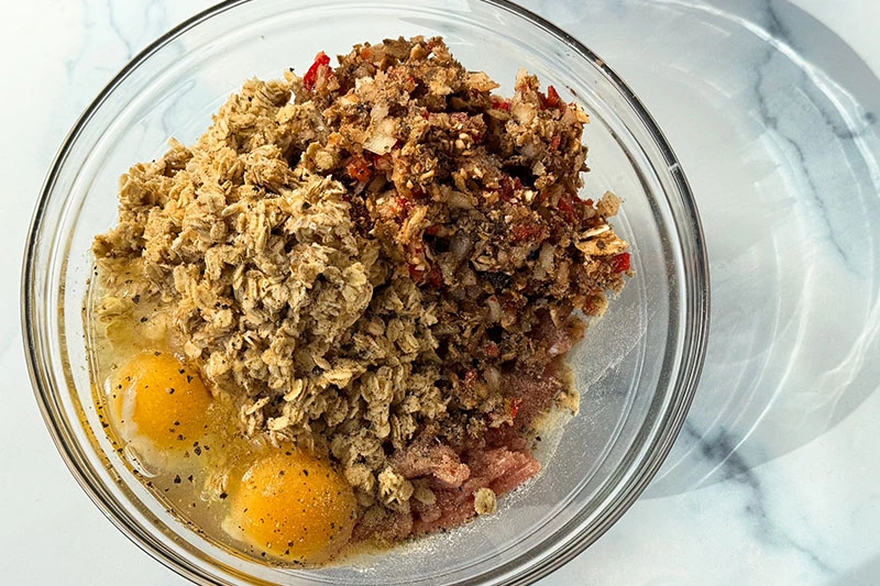 ingredients for meatloaf in a bowl.