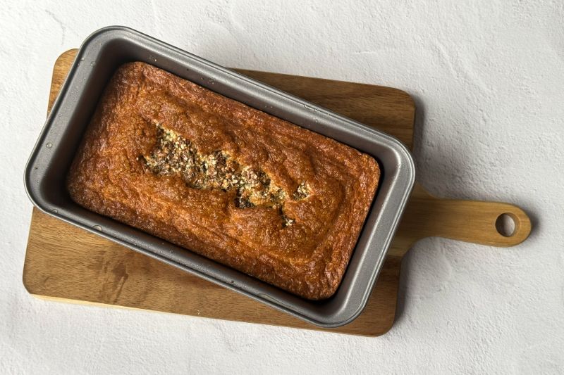 full size loaf of cottage cheese bread in a loaf pan.