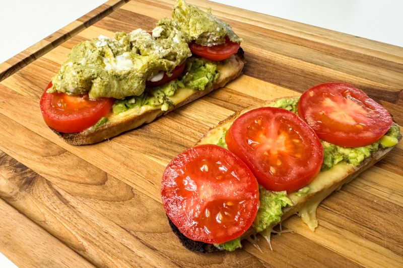 partially assembled scrambled pesto eggs on toast.