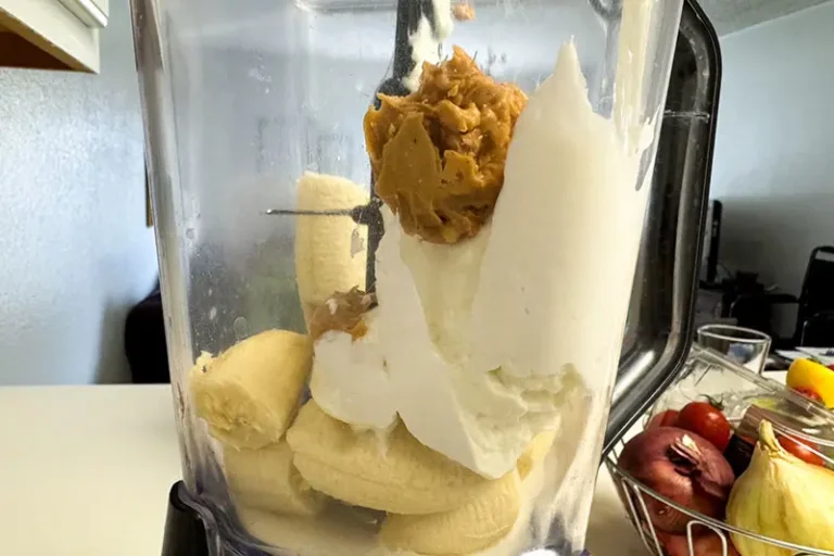 ingredients in a blender for frozen banana and peanut butter yogurt bars.