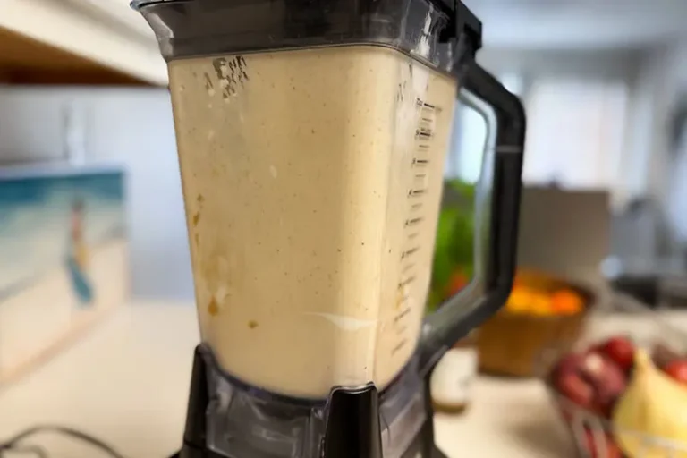 ingredients in a blender for frozen banana and peanut butter yogurt bars.
