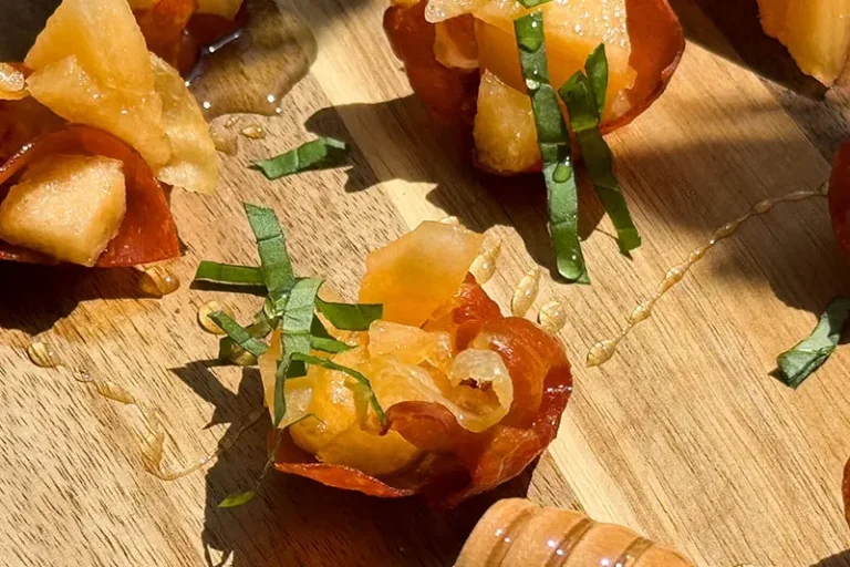 crispy prosciutto cups with hami melon.