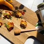 crispy prosciutto cups with hami melon.