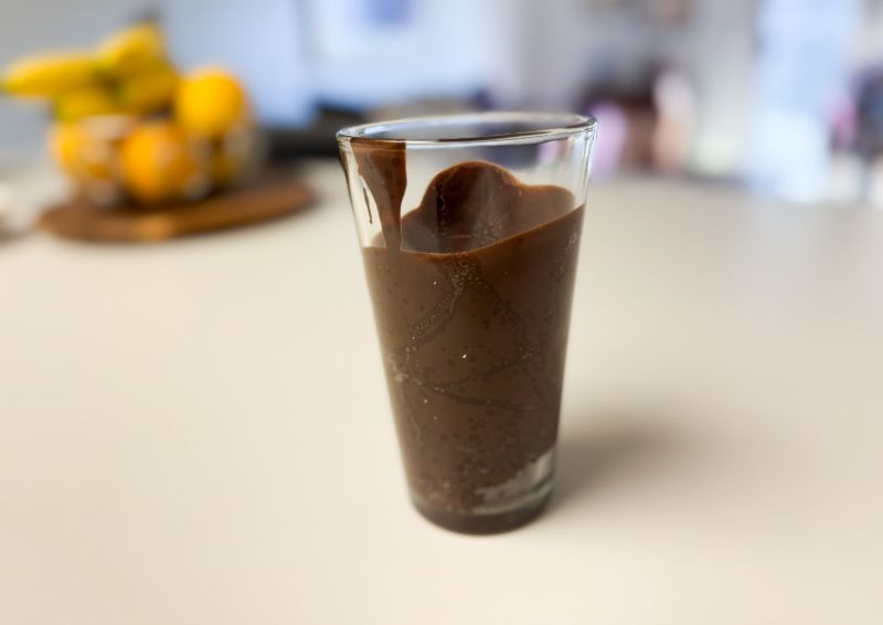 narrow glass with melted chocolate.