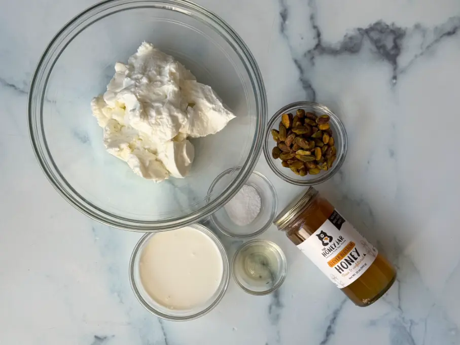 ingredients for whipped Greek yogurt with honey and pistachios.