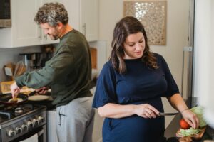 two people cooking.