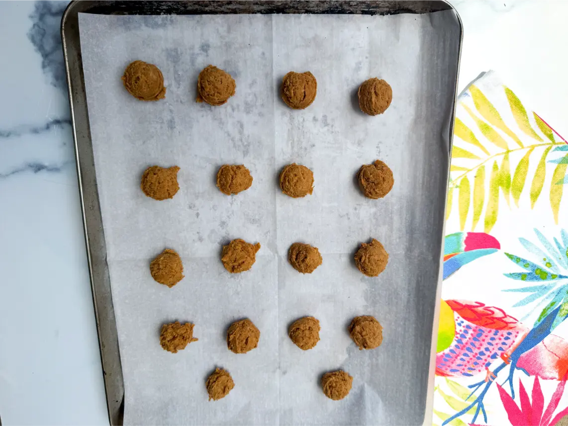 scooped dough balls on baking sheet.