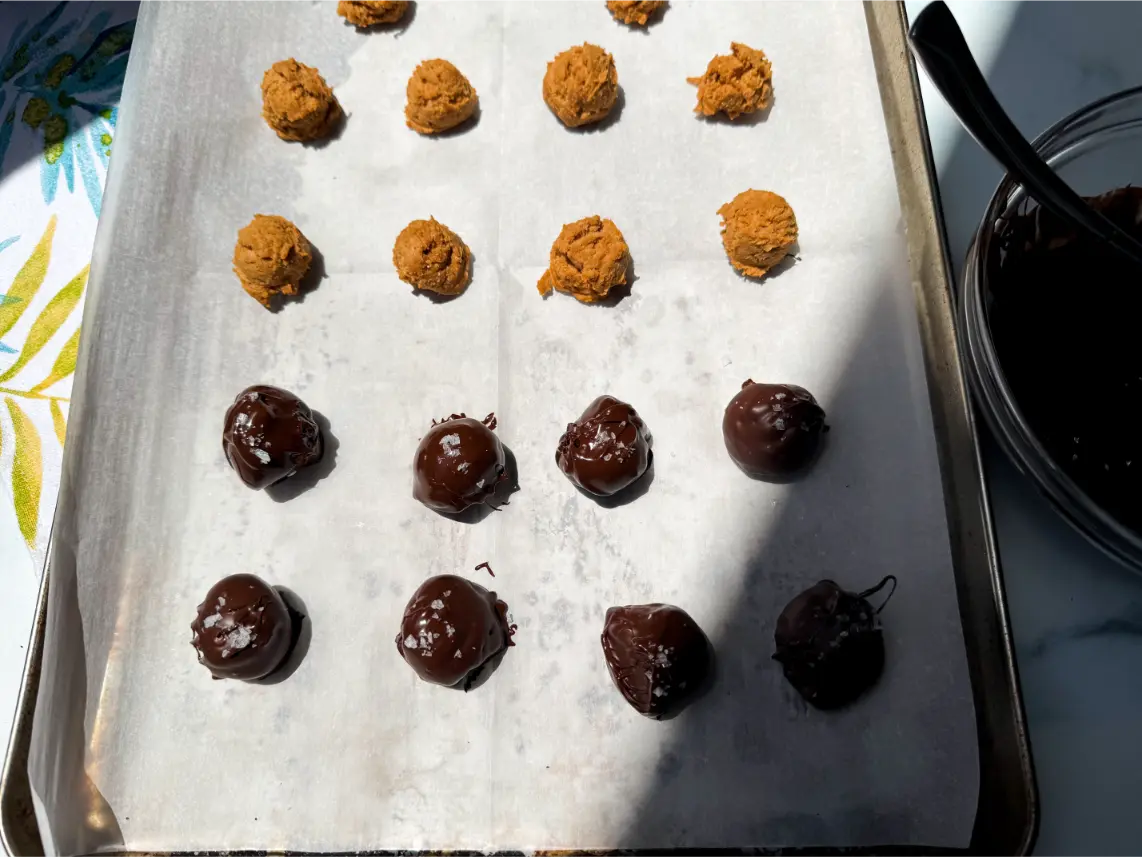 half of dough balls dipped in chocolate.