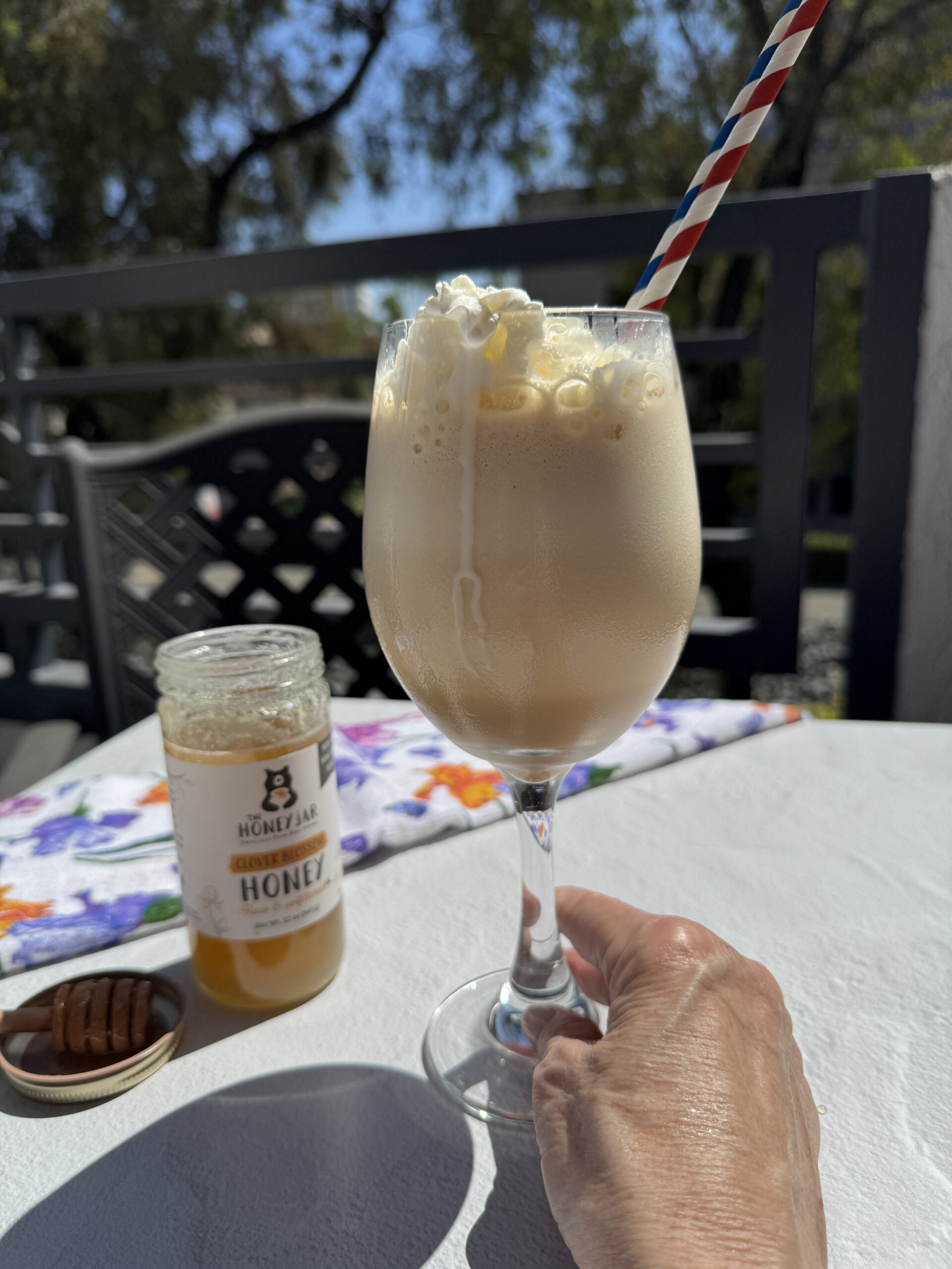 high protein honey vanilla frappuccino with bottle of honey.