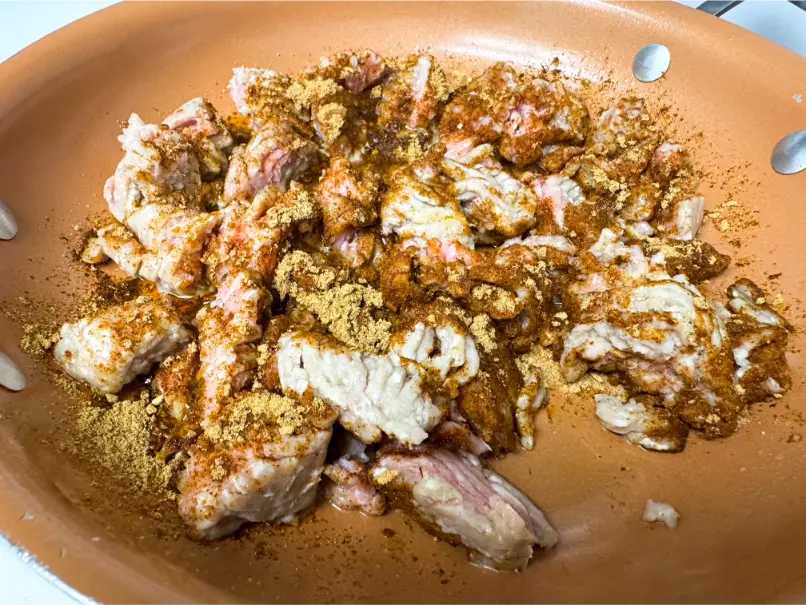 Ground turkey with spices in skillet.